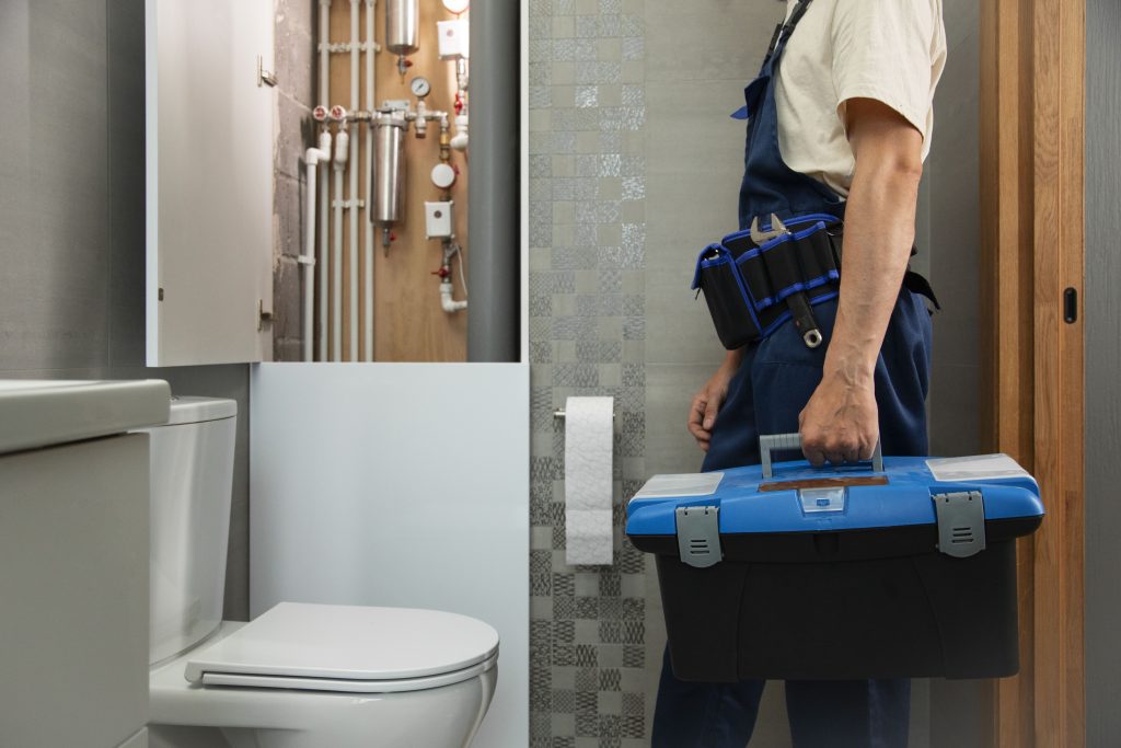 male plumber working fix problems client s house (1)